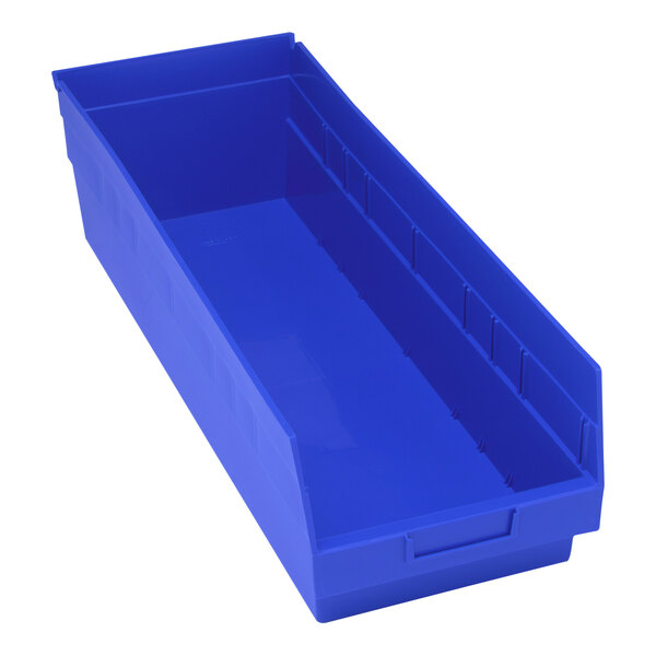 A close-up of a blue Quantum shelf bin with a blue handle.