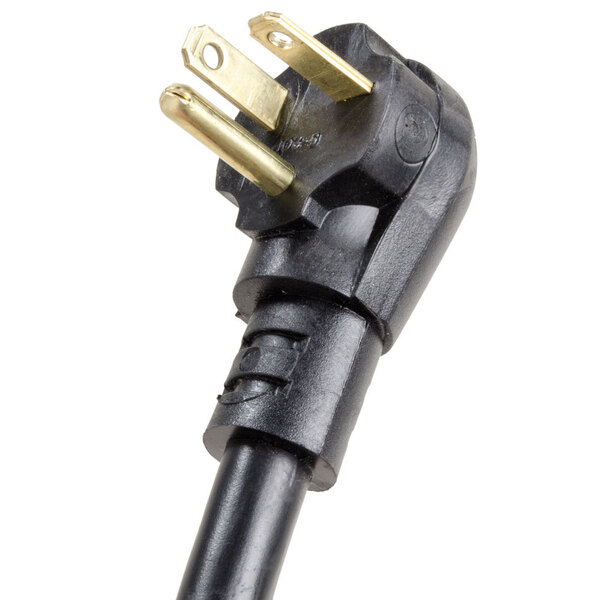 A black three-prong power cord plug for an outdoor walk-in cooler.