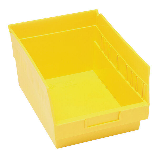 A yellow plastic Quantum shelf bin with two compartments.