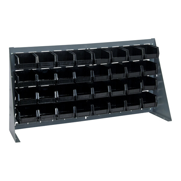 A gray steel bench rack with black plastic bins on it.