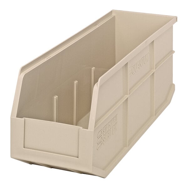 An ivory plastic Quantum stackable shelf bin with two compartments.