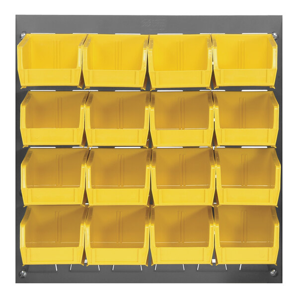 A gray Quantum louvered panel with yellow bins hanging on it.
