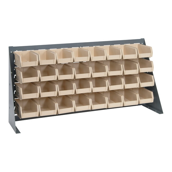 A Quantum gray steel bench rack with 32 ivory bins on it.