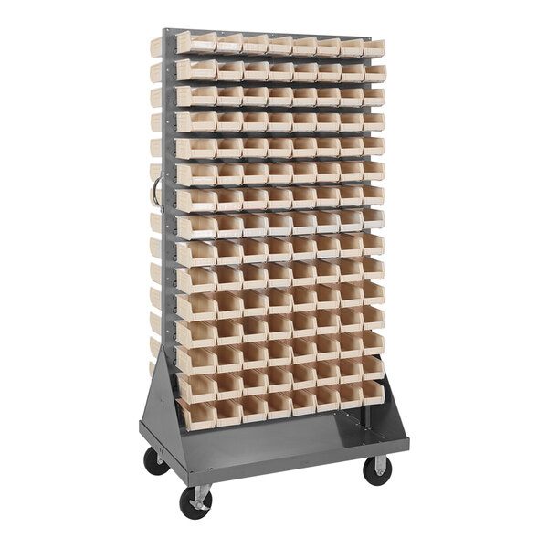 A Quantum gray steel double-sided louvered rack with many ivory bins on it.