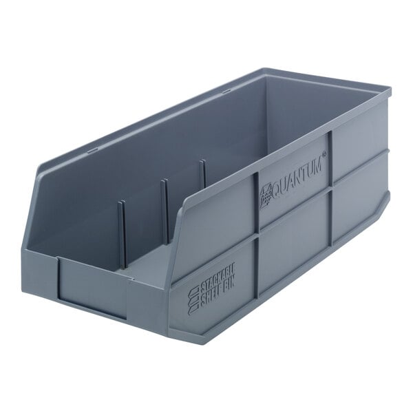 A gray plastic Quantum stackable shelf bin with a handle.