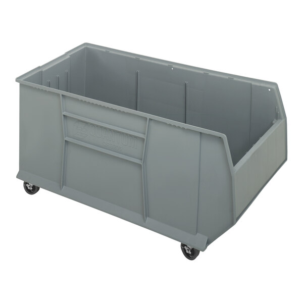 A Quantum gray plastic container with wheels.