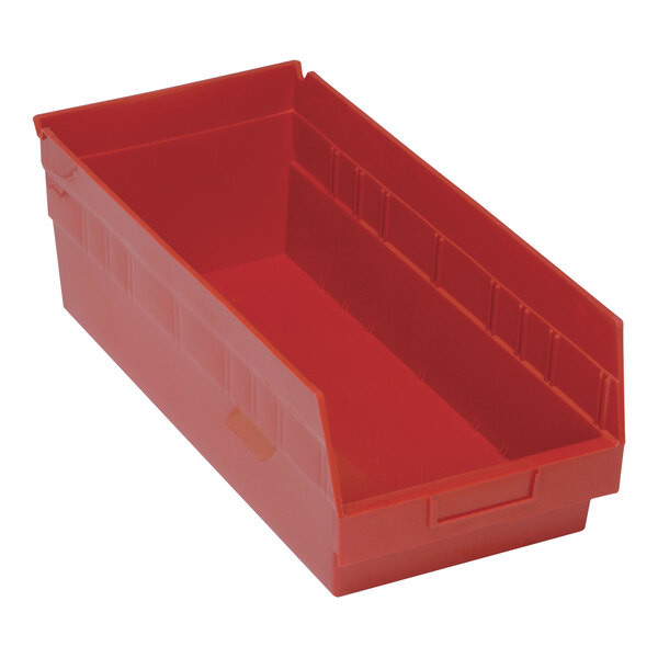 A red plastic Quantum shelf bin with two compartments.