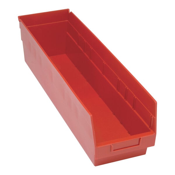 A red plastic Quantum shelf bin with two compartments.