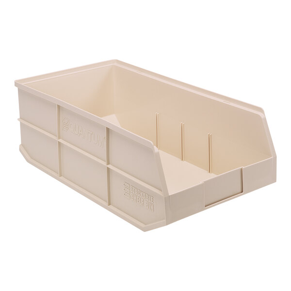 A beige plastic Quantum shelf bin.