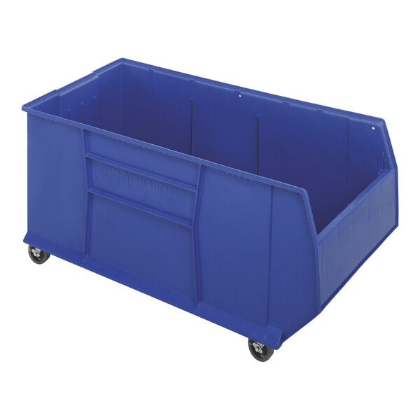 A blue plastic Quantum mobile pallet rack bin.