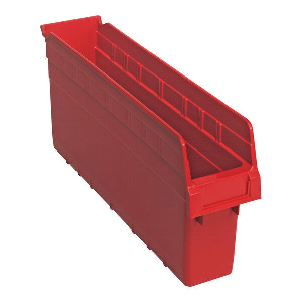 A red plastic Quantum shelf bin with three compartments.