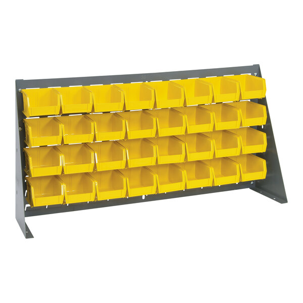 A Quantum gray steel bench rack with yellow bins on it.