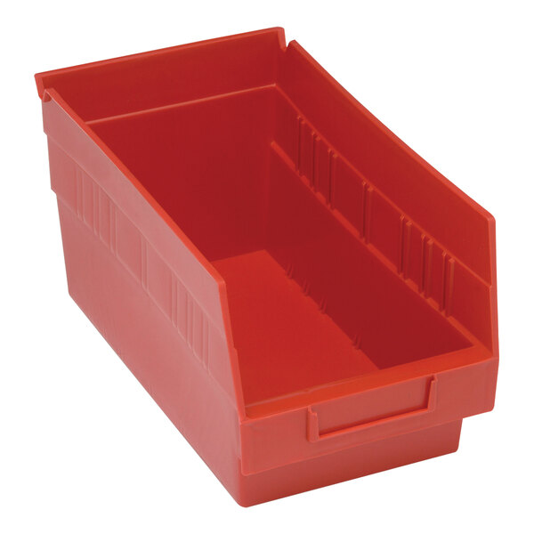 A red plastic Quantum shelf bin with a handle.
