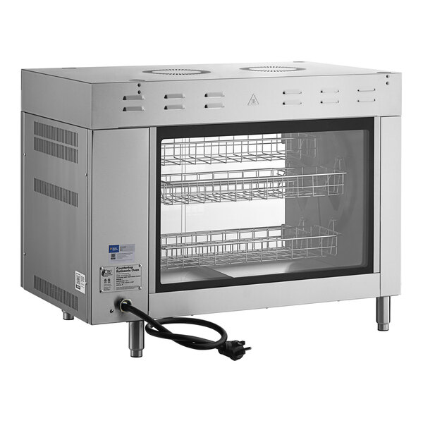 A silver Cooking Performance Group countertop rotisserie oven with wire baskets inside.