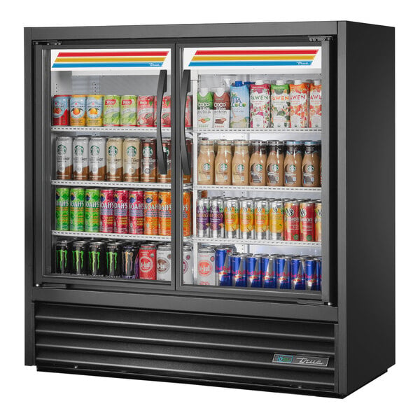 A True black refrigerated glass door merchandiser with drinks inside.