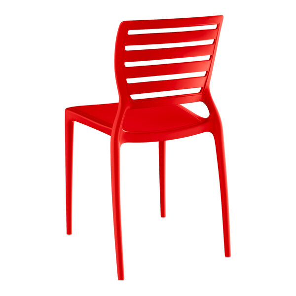 A red resin side chair with slats.