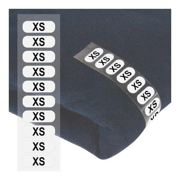 A roll of white rectangular clear labels with black XS's.