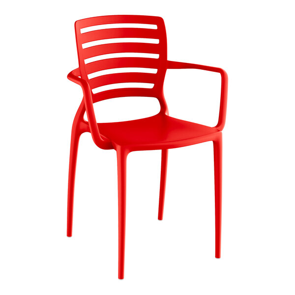 A red plastic Lancaster Table & Seating Sol Buoy arm chair.