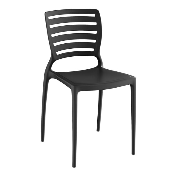 A black stone resin side chair with a slatted back.