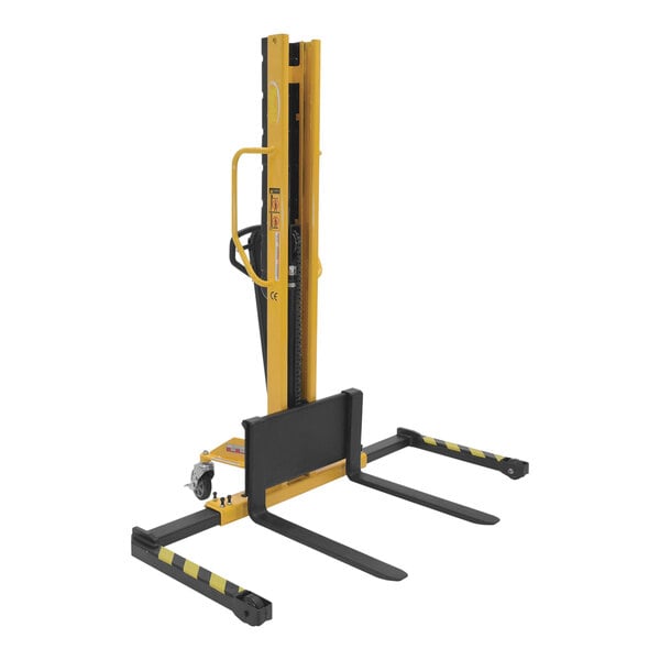 A yellow and black Vestil manual hydraulic fork stacker.