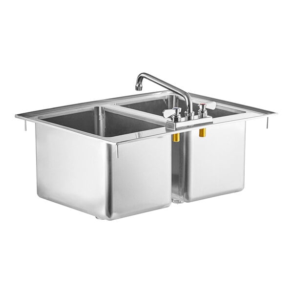 A Regency stainless steel sink with two faucets.
