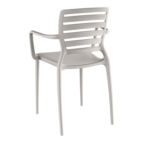 A white plastic Lancaster Table & Seating arm chair with a back and armrests.