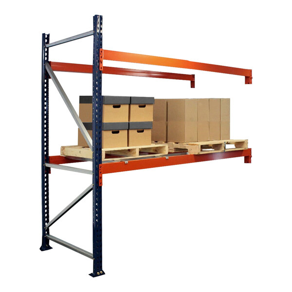 A blue and orange Interlake Mecalux heavy-duty bolted pallet rack with boxes on the shelves.