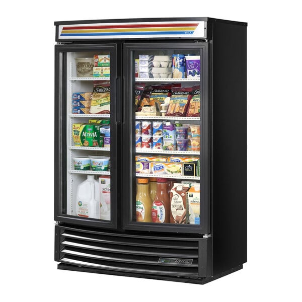 A True black refrigerated glass door merchandiser with shelves.