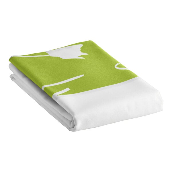 A folded white top sheet with green floral accents.