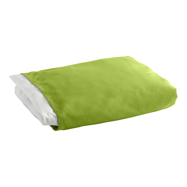 A folded lime green 1888 Mills king size bed skirt on a white surface.