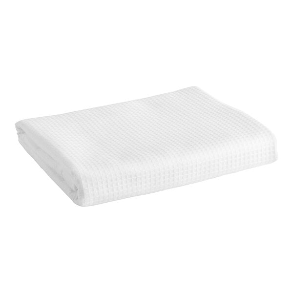 A white bed scarf with an embroidered design on a white background.