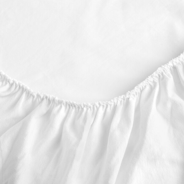 A beige polyester bed skirt with a ruffled edge.