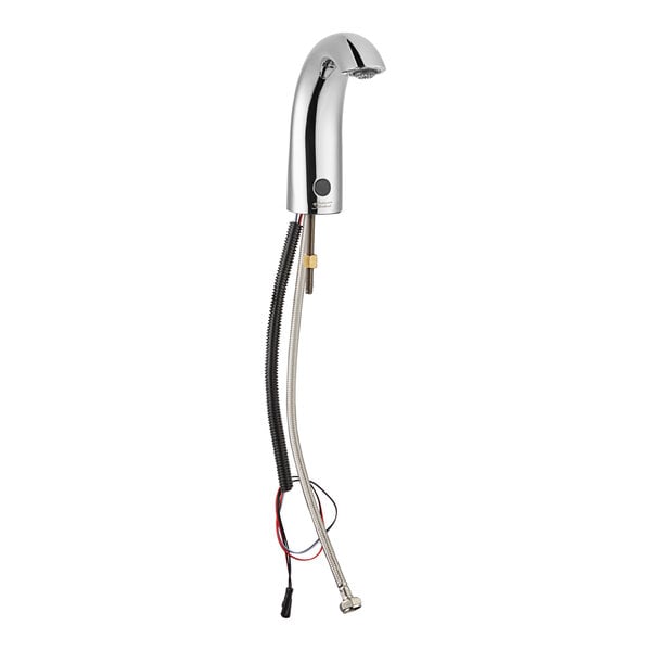 A close-up of a silver American Standard touchless lavatory faucet with wires.