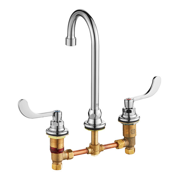An American Standard deck-mount faucet with wrist blade handles and a gooseneck spout in chrome.