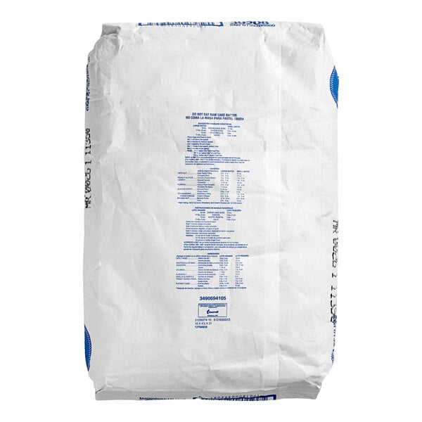A white bag of Pillsbury Creme Cake Base Mix with blue text.