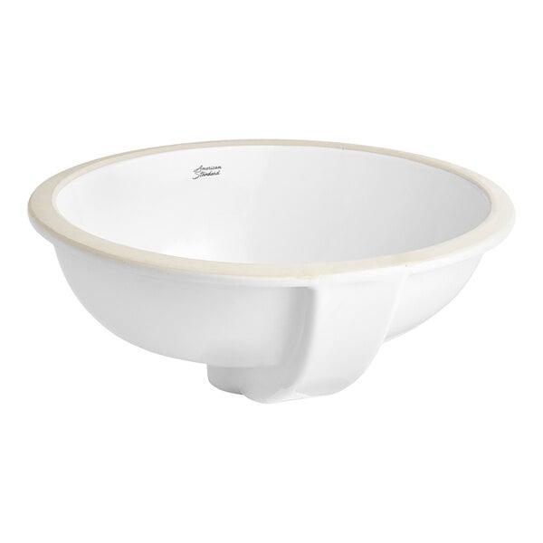 An American Standard white vitreous china oval undermount sink with a white bowl and rim.
