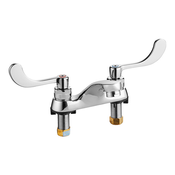 An American Standard deck-mount faucet with chrome and brass finish and wrist blade handles.