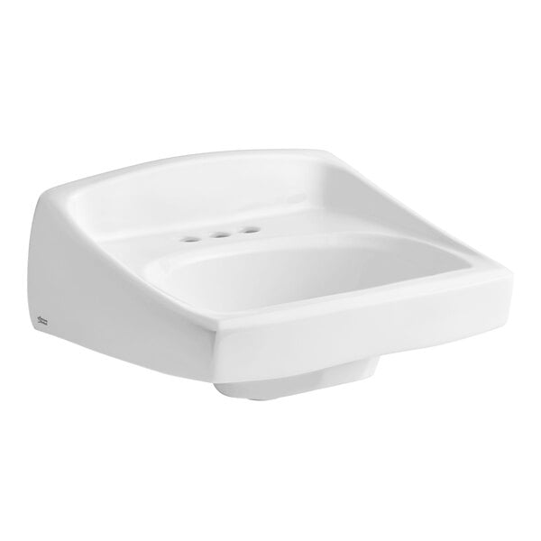 A white American Standard wall-mount commercial bathroom sink with three holes.
