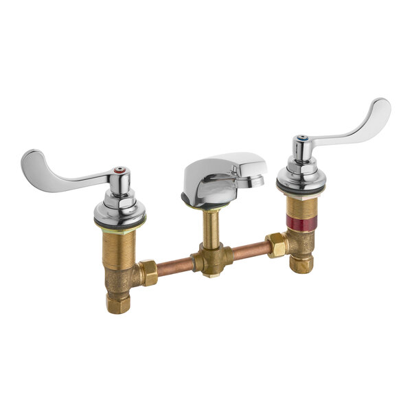 An American Standard deck-mount faucet with brass handles.
