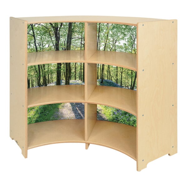 A Whitney Brothers wooden shelf with tree cutouts on the sides.