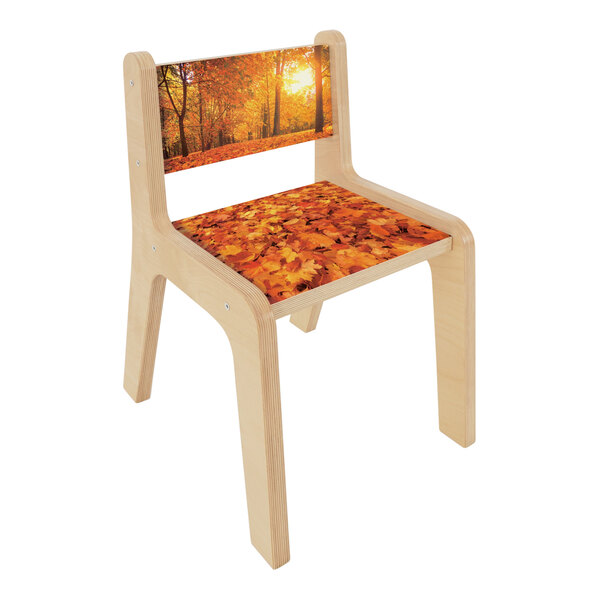 A Whitney Brothers children's wooden chair with an autumn leaf seat.