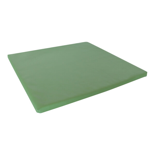 A green square vinyl floor mat.