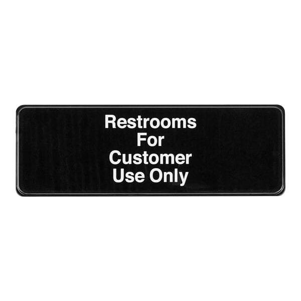 A black sign with white text that reads "Restrooms For Customer Use Only"