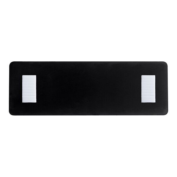 A white rectangular object with black text that says "No Smoking"