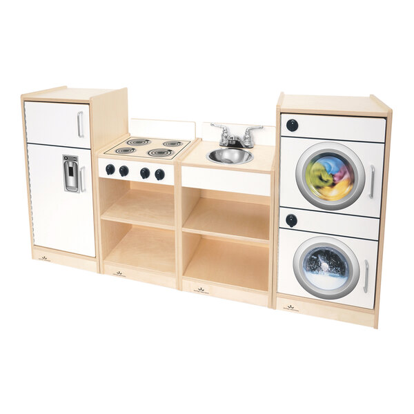 A white Whitney Brothers toddler kitchen ensemble with cabinets and a washing machine.