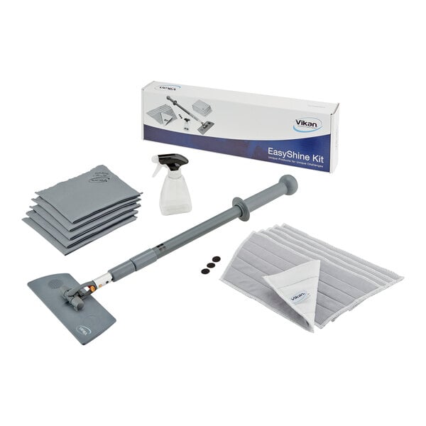 A Vikan Easyshine window cleaning kit with a cleaning tool, cloths and vacuum attachment in a box with a picture of the product.