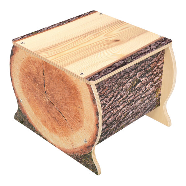 A Whitney Brothers wooden bench with a tree trunk design.