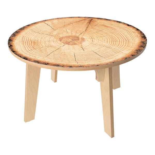 A Whitney Brothers round wooden table with a live edge top.