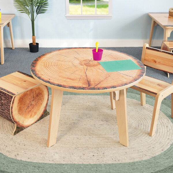 A Whitney Brothers wooden table with a live edge top.