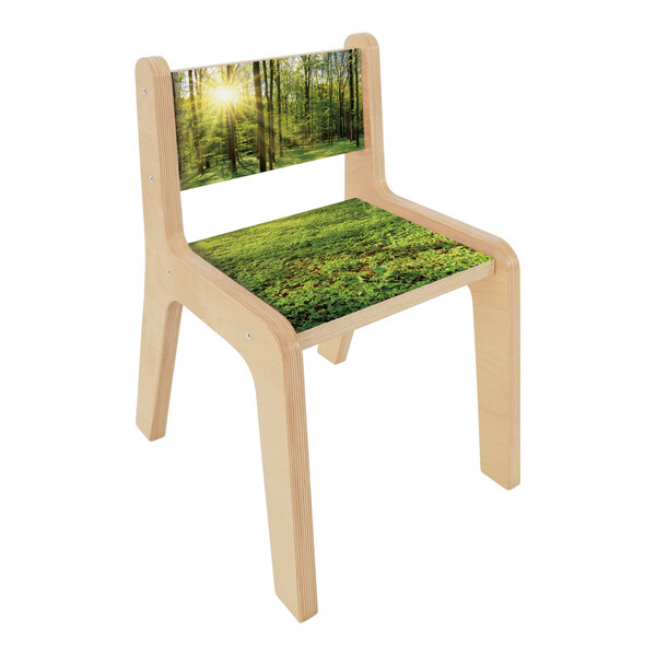 A Whitney Brothers wooden children's chair with a nature scene on the seat.